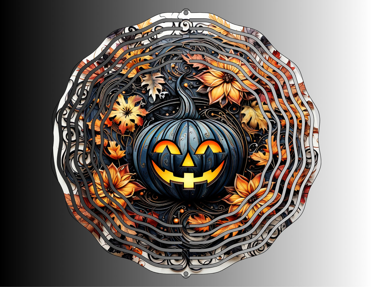 Black jack-o’-lantern Halloween wind spinner surrounded by orange autumn leaves, flowers and gothic scrollwork